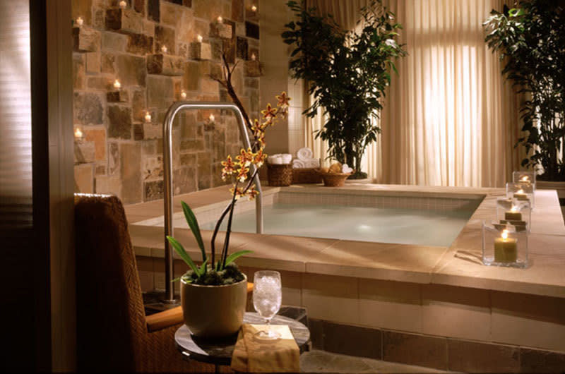 spa room with soothing colors, soft lighting, and luxurious features such as a Jacuzzi or sauna